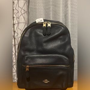 COPY - - New tag on Coach backpack. Super cute I’m more of a small clutch kind …